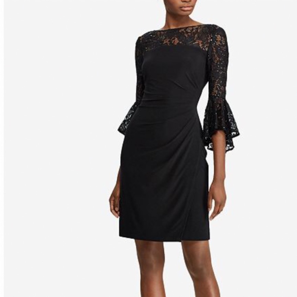 Formal black dress with lace top accents.